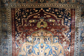 A very Fine antique Heriz Silk rug. A top flight collectable piece woven with beautiful, arabesque filled medallion on soft red ground. The silk on silk rugs are marvels to behold, technically  ...