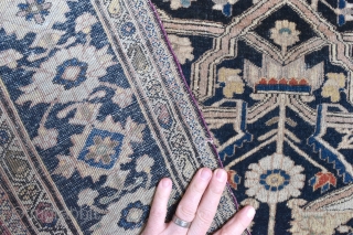 A fine antique Moteshem Kashan rug. Finely made with the beautiful wool and weave synonymous with the master weaver. Some corrosion/low pile, some small holes to ends Professionally conserved) remnants of original  ...