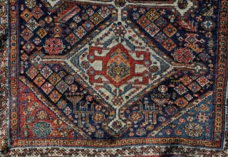 A beautiful antique qasgai rug with a design more commonly found on bigger carpets. Some old, high quality repair, a few lower areas, but generaly in good order. 176 x 101cm  