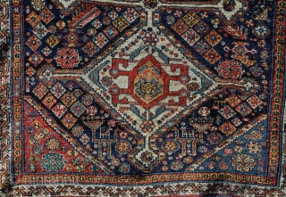 A beautiful antique qasgai rug with a design more commonly found on bigger carpets. Some old, high quality repair, a few lower areas, but generaly in good order. 176 x 101cm  