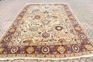 An Old Persian Tabriz carpet of Benlyan type. A highly decorative item with all-over palmetes and hunting animals woven in muted dyes on soft ivory ground. The piece is in excellent, original  ...