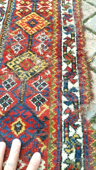 A good antique Khamseh carpet of large proportion. Lots of moth damage on one side, hence great for a restorer. Now deep cleaned and free from the little buggers! 13x5ft. Circa 1880. 