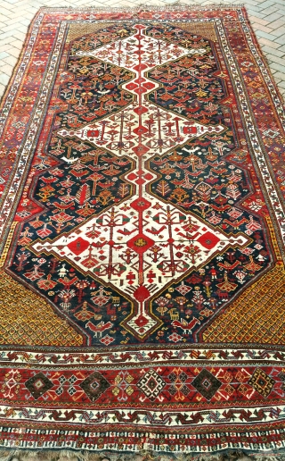 A good antique Khamseh carpet of large proportion. Lots of moth damage on one side, hence great for a restorer. Now deep cleaned and free from the little buggers! 13x5ft. Circa 1880. 