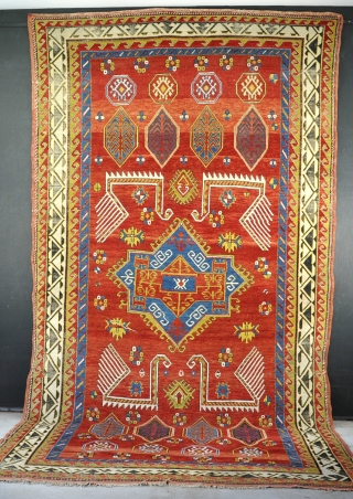 An antique Kazak carpet with huge birds, big and flashy with good dyes and decent wool. a couple of minor crease lines (worst shown) easily fixed if required, black corrosion, dusty, but  ...