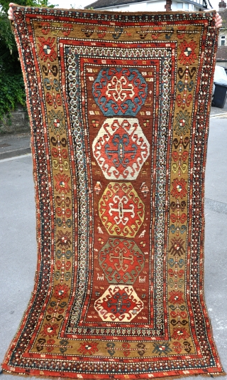 An antique Kurdish rug with good dyes in full pile. The design is clearly based on an early Borjalu kazak. One or two small holes, needs a wash. wool on wool. late  ...