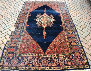 A very fine antique Senneh small carpet, good pile, but with obvious damages and very dirty but not stained. This would have been an expensive carpet. Now reasonably priced and ripe for  ...