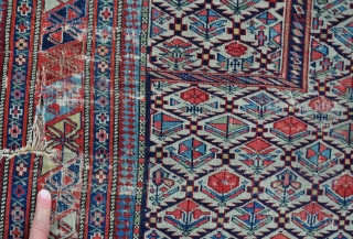 An exceptionally fine Shirvan prayer rug, woven on silk wefts. a little wear, s tear to left border, tatty around edges, one or two small faded repairs, needs a good wash. The  ...
