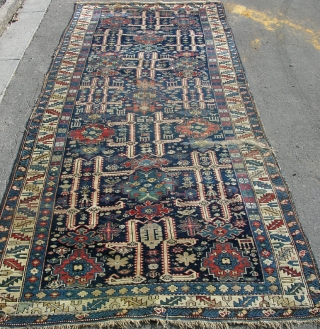 An antique Kuba carpet, circa 1880. 2 patches of lcal wear but mainly in full pile with original ends and sides and no repair. Perfect for resoration. 10x4 ft.    