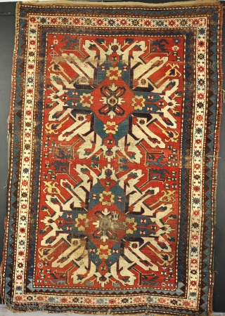 A good antique Eagle (Chelebered) Kazak rug with natural dyes and crisp drawing. worn,dirty, but untouched with its ends and sides, so suitable for a restorer. 19th century,     