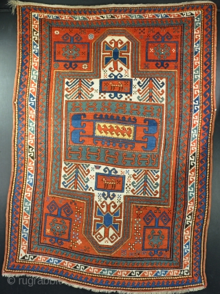 An old Sewen Kazak. Evenly low allover, one or two tiney repairs, good dyes with original ends and sides. Circa 1900            