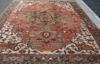 A good Heriz carpet in decent, original condition with very decorative colors. late 19th century. 12'3 x 10'1.               