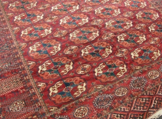 a Fine old Tekke main carpet with good dyes and shiney wool in mint condition with no repairs. Very crisp clean piece. 10x7. late 19th century.       