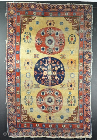 Antique Khotan, some wear wear but nicely drawn on bright yellow ground. Late 19th century.                  