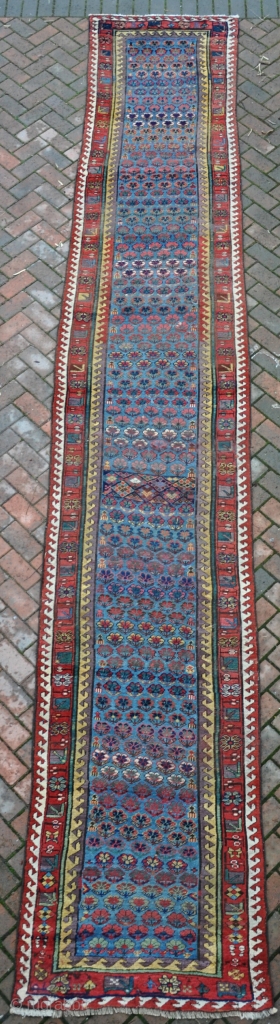 Unusual SaugBulag runner, very long and narrow, with vivid dyes. Quite a lot of decent quality reweave, but clean and floor ready. 548x89cm. Mid 19th century.       