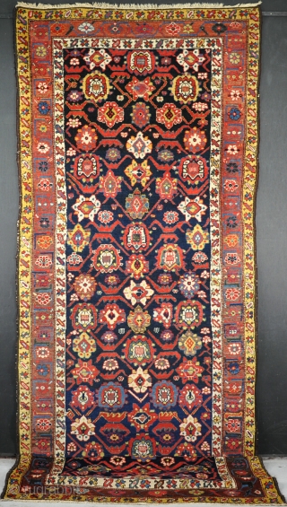 An unusual North West Persian long rug with good dyes and shiny wool. One or two spots of slight wear, but mainly in thick pile. 350x120       