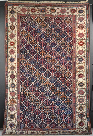 Antique Shekarlu Qasgai carpet with unusual lattice field. Good condition, a few old slightly faded repairs, but very clean with original ends and sides.241x143cm         