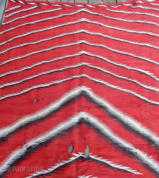 Navajo Weaving   Late 19th Century -  Early  20th Century  --  Size 9'3"  x  5'3"  --  This piece has damage, see the photos.  ...