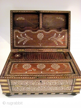 Anglo-Indian portable writing desk, c. 1825. In exceptional condition, with exquisite workmanship.  18"L x 12"D x 8"H.  Rosewood inlaid with ivory and ebony, brass fittings. Original key included.   