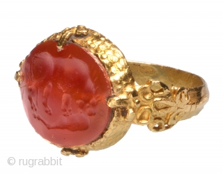 Jewelry Auction Nov 30, 2016: Islamic Intaglio Ring with Boar (Est: $4,000/$6,000). 

Oval bezel composed of stamped sheet gold, the shoulders shaped in double spirals and palmettes. The decorative sprue at the  ...