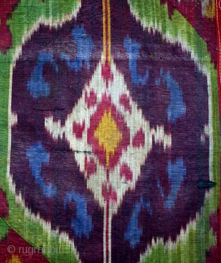 19th cent beatiful uzbek ikat fragment.it has very good veg dyes colours. very unusual desing.the size is 128 by 45cm. for more information please mail me.       