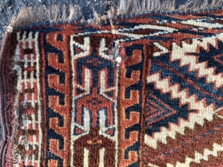 Yomud Turkoman Asmalyk, late 19th century, 2-1 x 3-8 (64 x 112), rug was hand washed, good pile, left edge has long  tare, 4-5 small holes, 4 green silk highlights in  ...