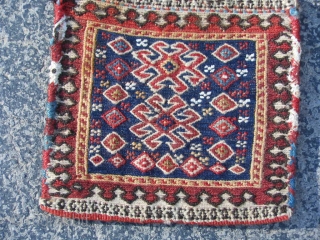 Persian Lori/Bakhtiar Chanteh Soumak bag, 7" x 7", late 19th century, weft wrapping technique, small discolored area top left border, good condition, comb design kilim back, nice colors.     