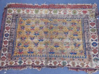 Caucasian Soumac fragment, late 19th century, 2-5 x 3-8 (.74 x 1.12), great greens and yellow, cut and rejoined, worn, holes, rug was washed, plus shipping.       