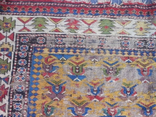 Caucasian Soumac fragment, late 19th century, 2-5 x 3-8 (.74 x 1.12), great greens and yellow, cut and rejoined, worn, holes, rug was washed, plus shipping.       