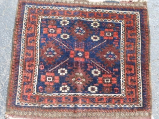 Persian Baluch bag face, late 19th century, 2 x 2-1 (.61 x .64), good condition, kilim ends, blacks oxidized, I washed this bag face. 
        