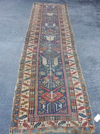 Caucasian Shirvan runner,  3-1 x 10-8 (.94 x 3.25),  circa 1870, great colors, wear, both edges rough in places, one end missing minor guard border, browns and blacks oxidized, many  ...