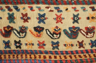 Qashqa'i horse cover, late 19th century. Beautifully saturated naturally dyed motifs. The flaps are different in design from one another. a bit of repiling in the left hand flap visible in the  ...