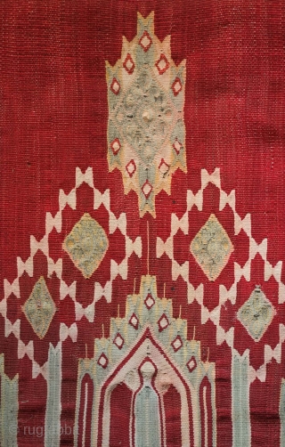 Syrian hanging, 19th century.  Fine wool base in madder and some design elements in cotton.  Design elements in the center recall pre- and early C.E. Central Asian motifs. 
 Mounted  ...