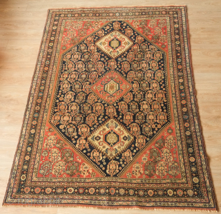 Qashqa'i rug, late 19th century.  Possibly Kashkuli. Elegant botehs and overall composition.  Subtle color scheme also adds to the rug's elegant feel.  Deep indigo blue ground.  Pile is  ...