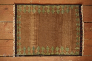 Qashqai small sofreh, 19th Century. Variegated camel wool ground and natural yellow-green in a reciprocating trefoil border motif, and red and blue in the nested fork soldat ends.  It would have  ...