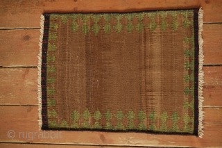 Qashqai small sofreh, 19th Century. Variegated camel wool ground and natural yellow-green in a reciprocating trefoil border motif, and red and blue in the nested fork soldat ends.  It would have  ...