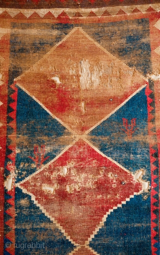 Qashqa'i Gabbeh, Mid 19th Century. Beautiful saturated colors including a rich purple in one of the serrated borders.  Two human figures woven into the field.  The design forms a mihrab  ...