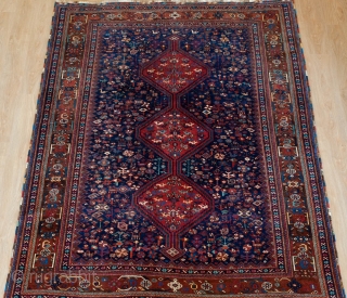 Khamseh Rug, Late 19th/early 20th Century.  Fantastic deep indigo blue ground.  Exceptional border.  Natural colors.  Possibly Arab Jabbareh group but the knots are symmetrical.  171 x 212  ...