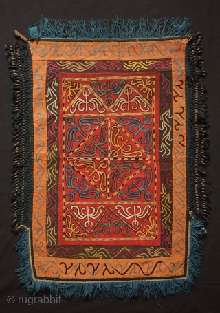 Kyrgyz Embroidered Hanging Panel, Late 19th/early 20th Century. Silk embroidery on felt broadcloth.  Blue silk tassels and black silk netting around the edges.  Two loops at the top from where  ...