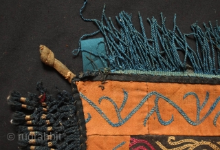 Kyrgyz Embroidered Hanging Panel, Late 19th/early 20th Century. Silk embroidery on felt broadcloth.  Blue silk tassels and black silk netting around the edges.  Two loops at the top from where  ...