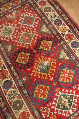 Chajli Caucasian rug, 3rd-4th quarter of the 19th century. A fantastic blitz of vibrant colors. The pile is generally good but for the areas of obvious wear.  123 x 183 cm 
