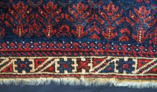 Baluch bag face, 19th century. Floral motifs surrounding the central medallion enclosing derivative dragon motifs.  Plush silky wool.  A small piece taken out of the bottom right side.  80  ...