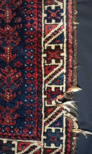 Baluch bag face, 19th century. Floral motifs surrounding the central medallion enclosing derivative dragon motifs.  Plush silky wool.  A small piece taken out of the bottom right side.  80  ...