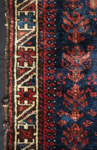 Baluch bag face, 19th century. Floral motifs surrounding the central medallion enclosing derivative dragon motifs.  Plush silky wool.  A small piece taken out of the bottom right side.  80  ...