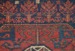 Baluch bag face, 19th century. Floral motifs surrounding the central medallion enclosing derivative dragon motifs.  Plush silky wool.  A small piece taken out of the bottom right side.  80  ...