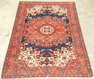 Hamadan rug, late 19th, early 20th century.  It bears an exquisite central medallion in Chinese cloud band and cloud collar elements. The medallion is flanked with birds in the four corners.  ...
