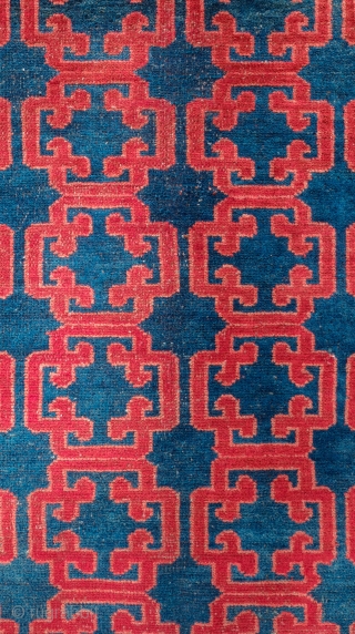 Kyrgyz Rug, 1900.  Khotan-Ningxia cloud-lattice design in the field.  The lighter spots on the image of the main rug are due to sun spots shining through the shade.  There  ...