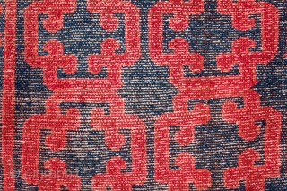 Kyrgyz Rug, 1900.  Khotan-Ningxia cloud-lattice design in the field.  The lighter spots on the image of the main rug are due to sun spots shining through the shade.  There  ...