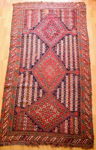 Khamseh-Qashqa'i Rug, 19th Century.  Kashmir shawl ground design with varying color schemes between the end sections and the center area with triple medallions. Selvedges mostly in tact with worn areas and  ...