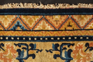 Ningxia Small Rug,Late 19th Century.  Wonderful graphic.  Soft, supple wool.  Elephant head motifs facing each other inside the central medallion.  An elegant small rug.  59 x 95  ...