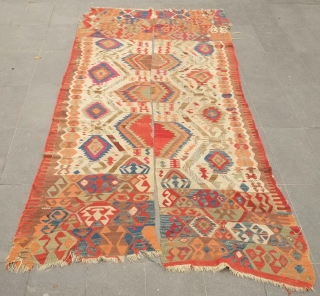 Fetiye Area Kilim, mid-9th century.  Good colors with a soft green and a rich apricot.  Archaic drawing. Corrosion of the browns.  150 x 340 cm. Contact danauger@tribalgardenrugs.com   